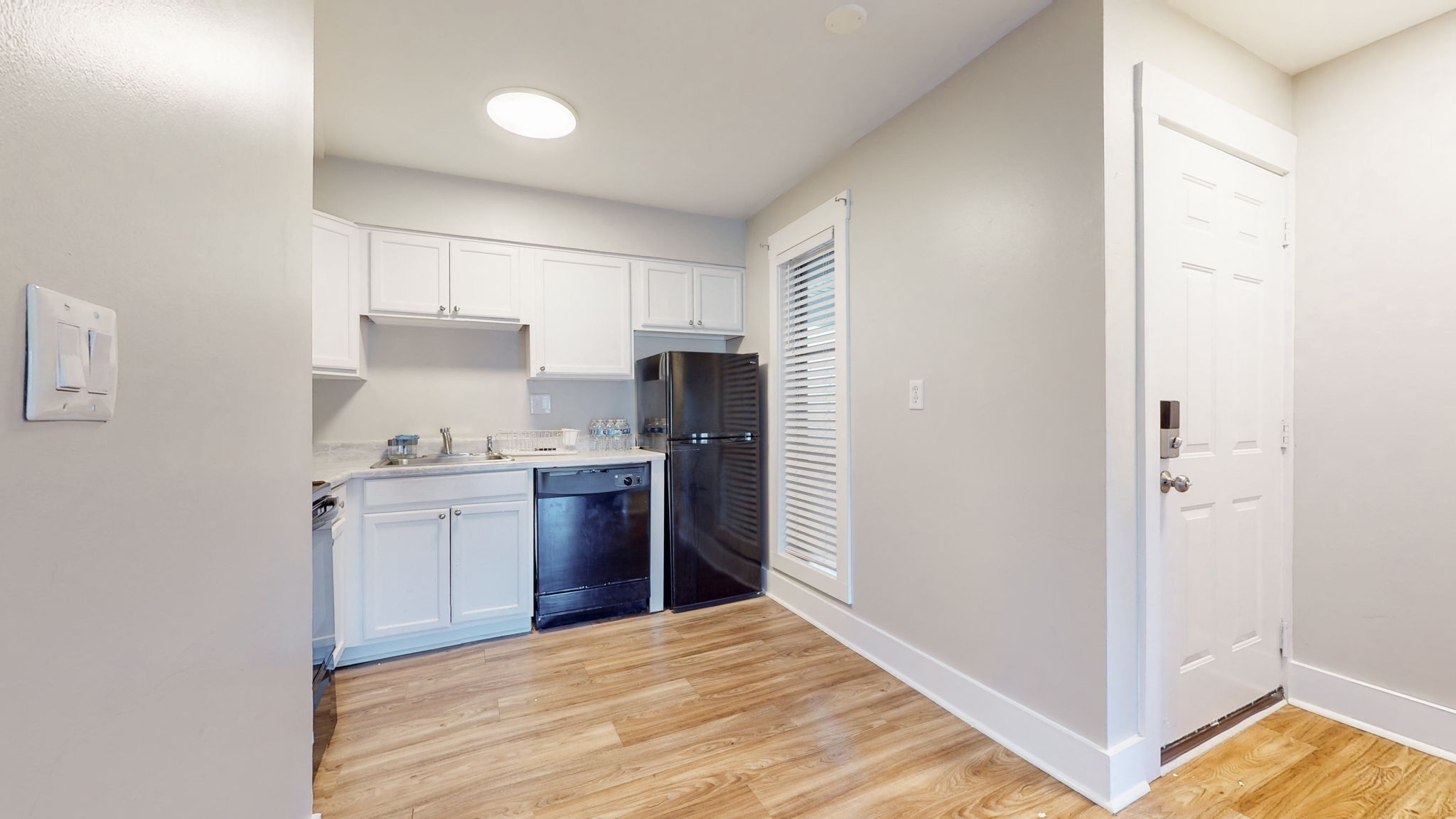 320 Welch Road, Unit P2 Nashville, TN 37211 - Photo 8 of 22 a kitchen with a refrigerator and a stove top oven