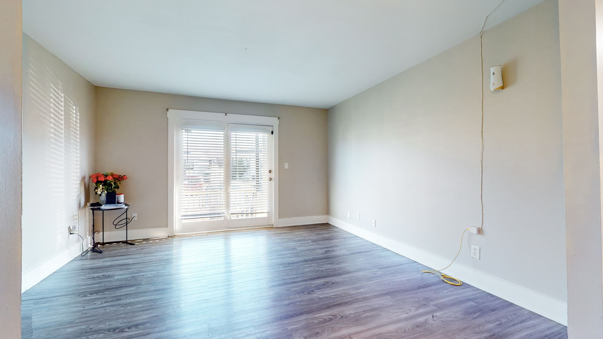 320 Welch Road, Unit P2 Nashville, TN 37211 - Photo 9 of 22 a view of an empty room with wooden floor and a window