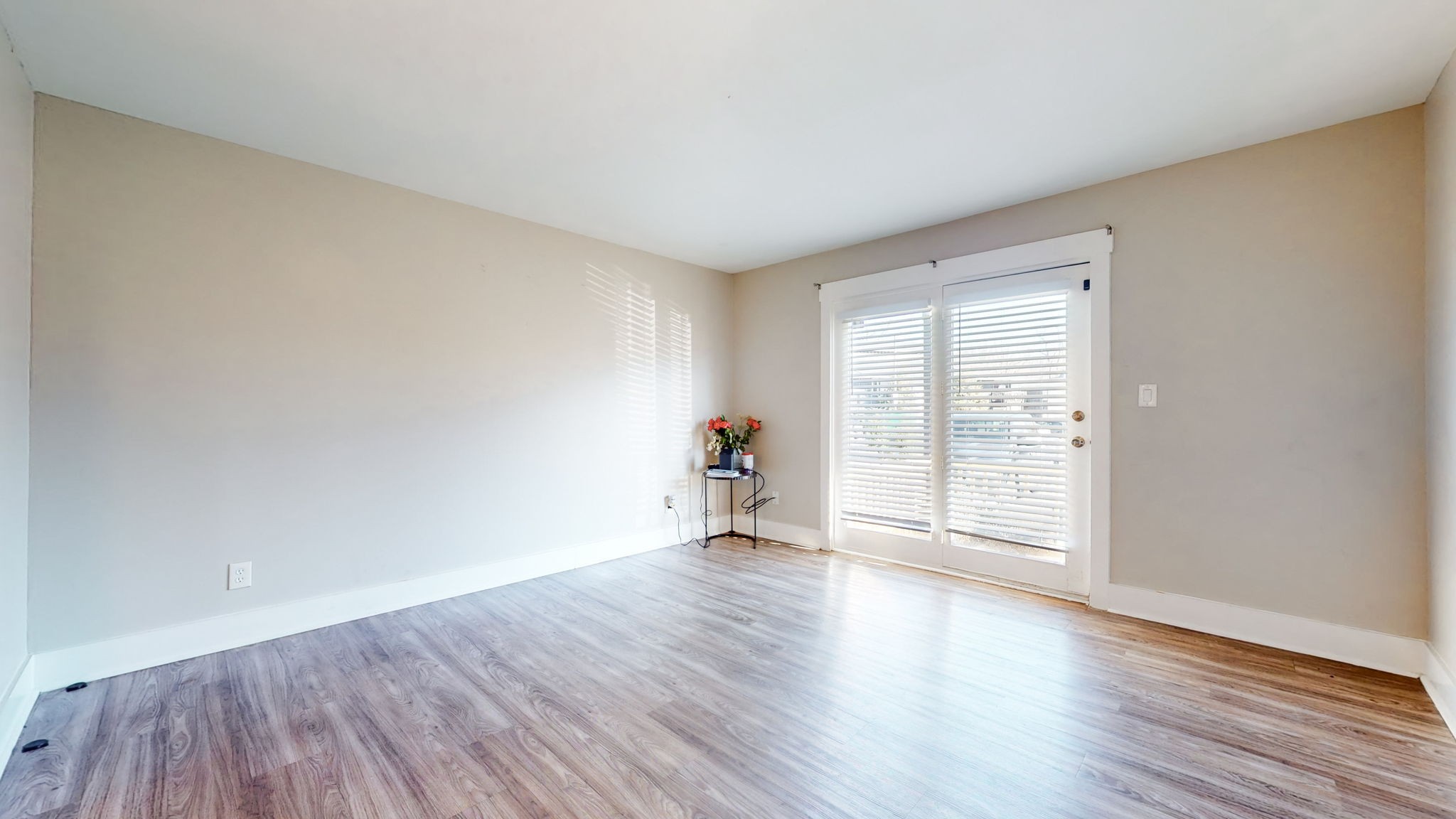 320 Welch Road, Unit P2 Nashville, TN 37211 - Photo 10 of 22 a view of an empty room with wooden floor and a window