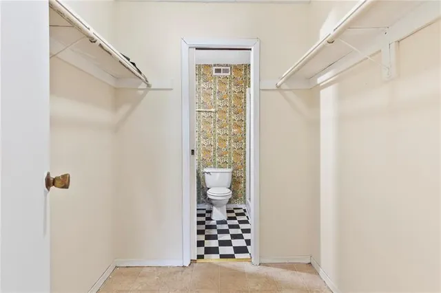 a bathroom with a shower toilet and sink