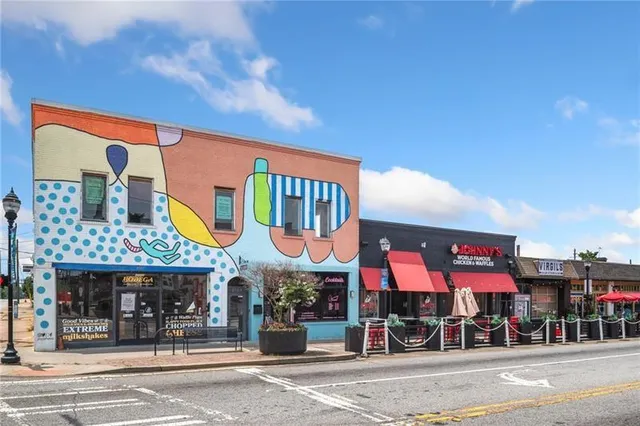 a view of a food mall next to a building