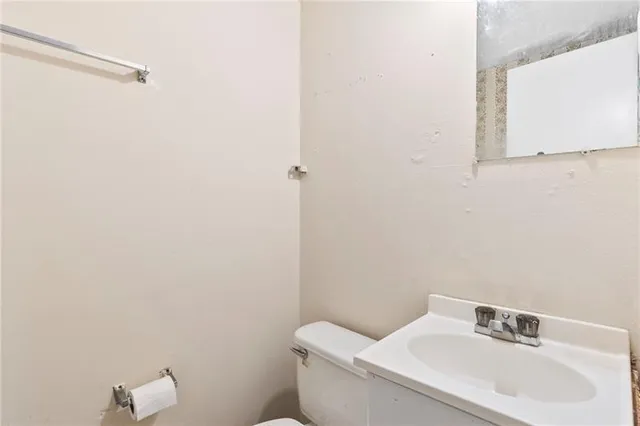 a bathroom with a sink and mirror