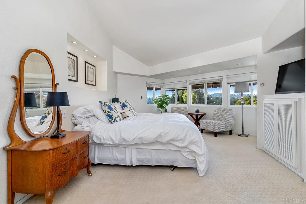 1239 Jamacha Road El Cajon, CA 92019 - Photo 11 of 24 a spacious bedroom with bed and a flat screen tv