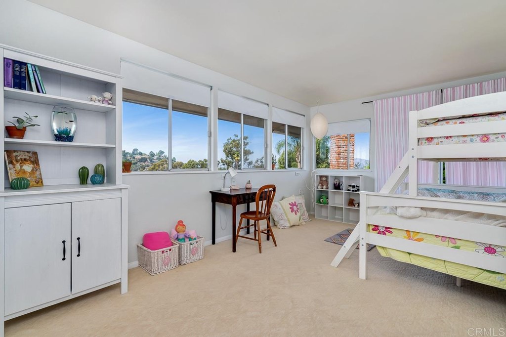 1239 Jamacha Road El Cajon, CA 92019 - Photo 16 of 24 a room with furniture a rug and white walls