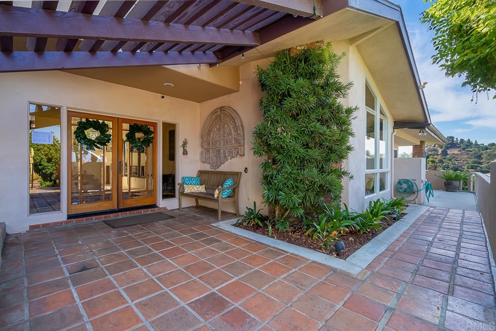 1239 Jamacha Road El Cajon, CA 92019 - Photo 3 of 24 a view of a porch with a table and chairs