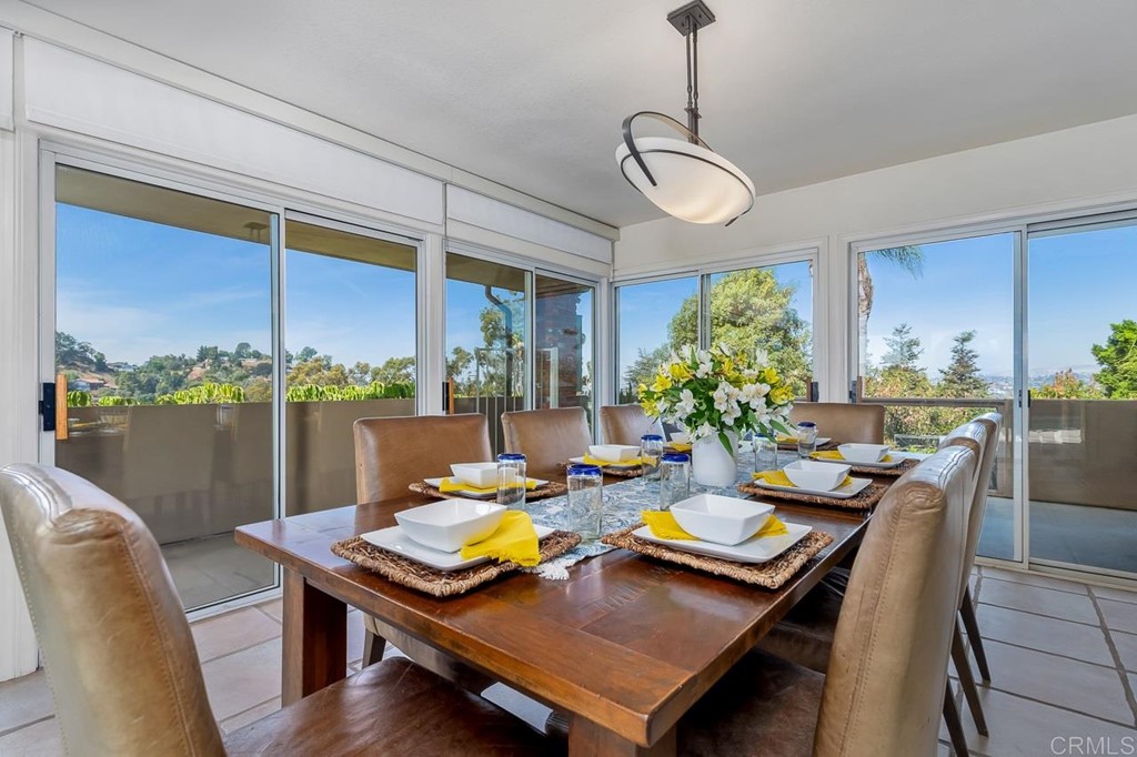 1239 Jamacha Road El Cajon, CA 92019 - Photo 7 of 24 a view of a dining room with furniture window and wooden floor