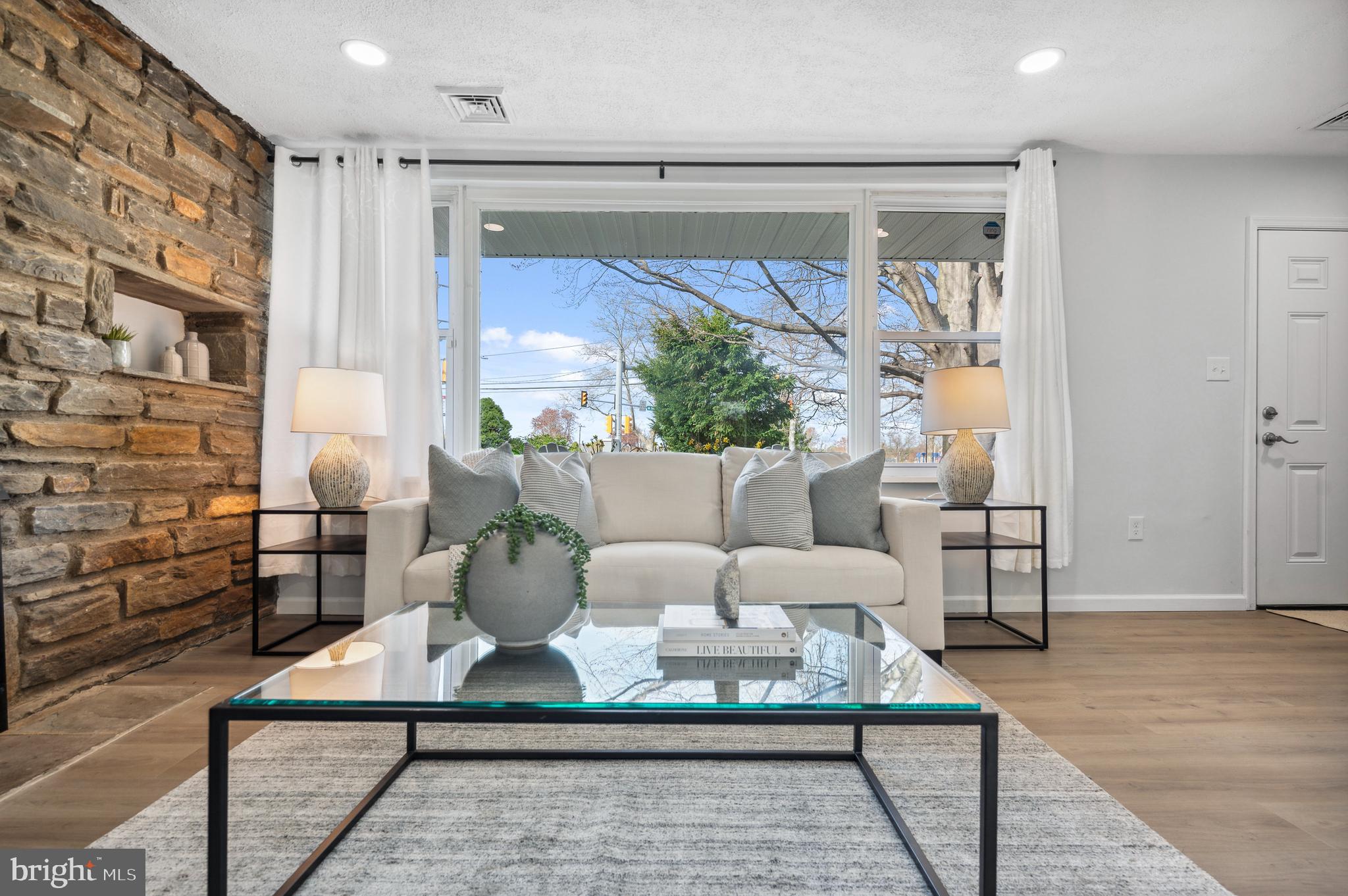 2210 Sproul Road Broomall, PA 19008 - Photo 12 of 26 a living room with furniture and a potted plant