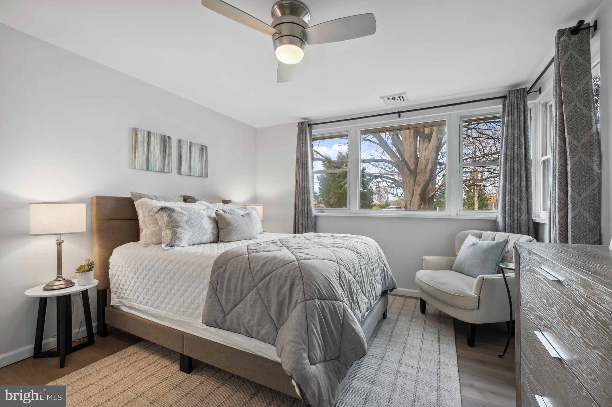 2210 Sproul Road Broomall, PA 19008 - Photo 13 of 26 a bedroom with a bed and wooden floor