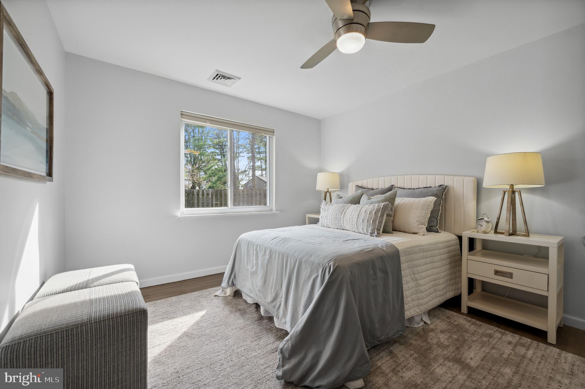 2210 Sproul Road Broomall, PA 19008 - Photo 17 of 26 a bedroom with a bed and a window