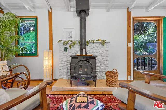 a bedroom with furniture and a window