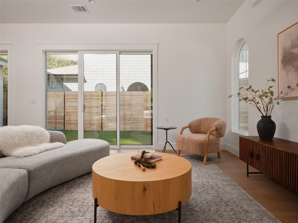 610 Allen Street, Unit 1 Austin, TX 78702 - Photo 13 of 32 Sitting room with wood finished floors and healthy amount of natural light