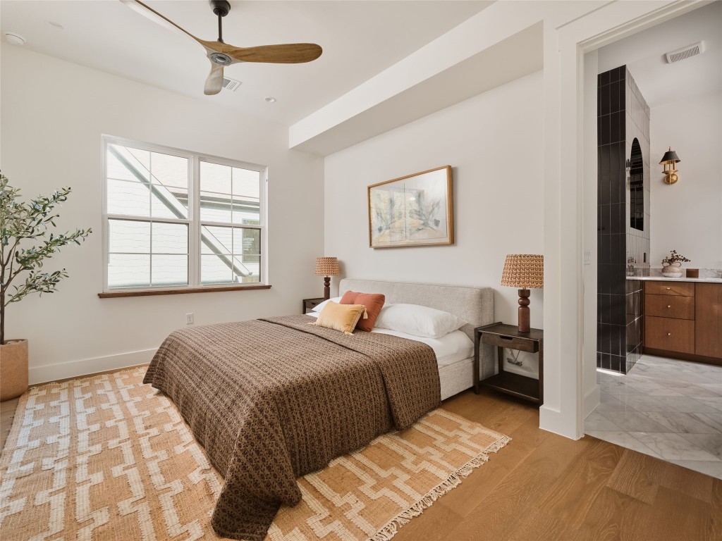 610 Allen Street, Unit 1 Austin, TX 78702 - Photo 15 of 32 Bedroom featuring light wood-type flooring and a ceiling fan