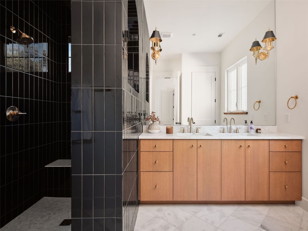 610 Allen Street, Unit 1 Austin, TX 78702 - Photo 17 of 32 Full bathroom with walk in shower and double vanity