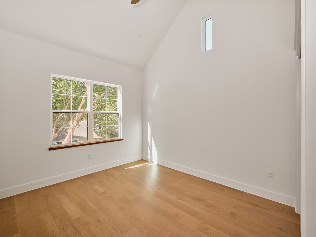 610 Allen Street, Unit 1 Austin, TX 78702 - Photo 26 of 32 Spare room featuring high vaulted ceiling and light wood-style flooring