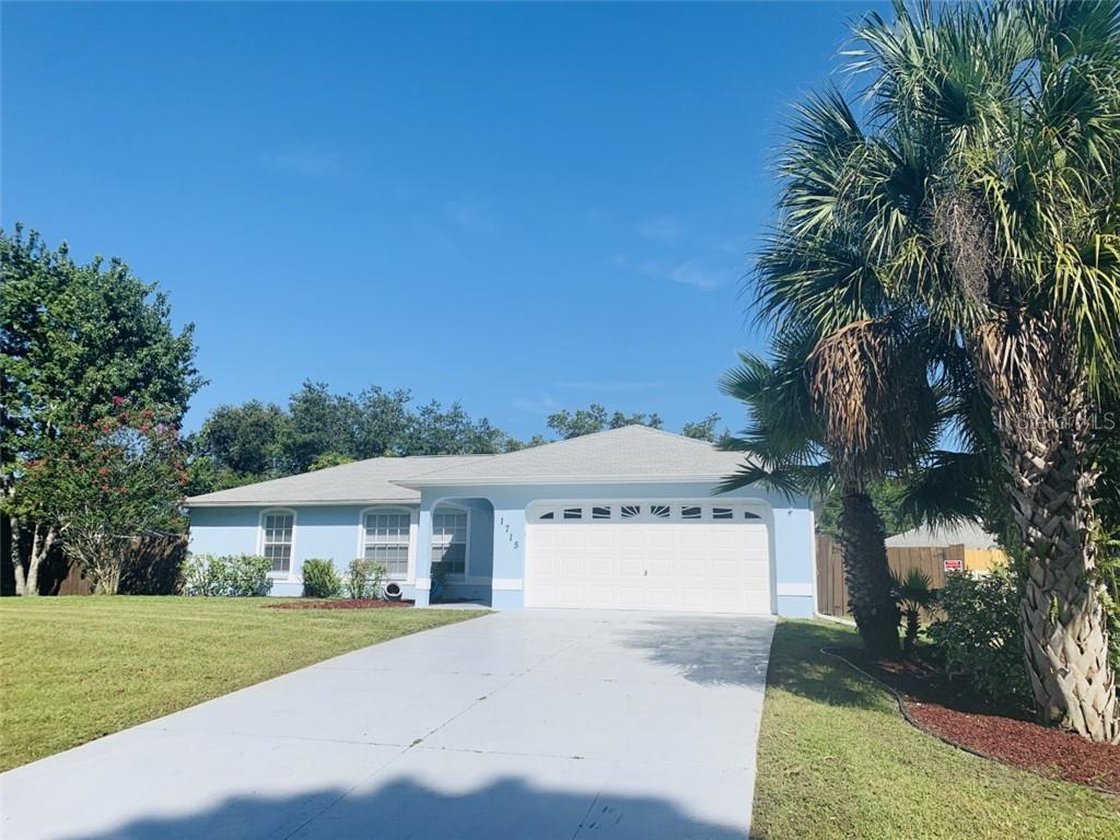 1715 Rival Terrace North Port, FL 34286 - Photo 1 of 1 a view of a house with a yard and potted plants