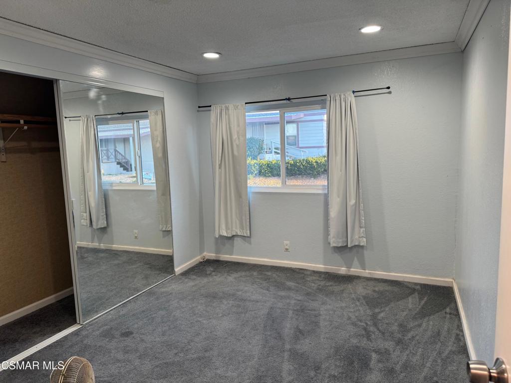 40701 Rancho Vista Boulevard, Unit 76 Palmdale, CA 93551 - Photo 13 of 31 an empty room with windows