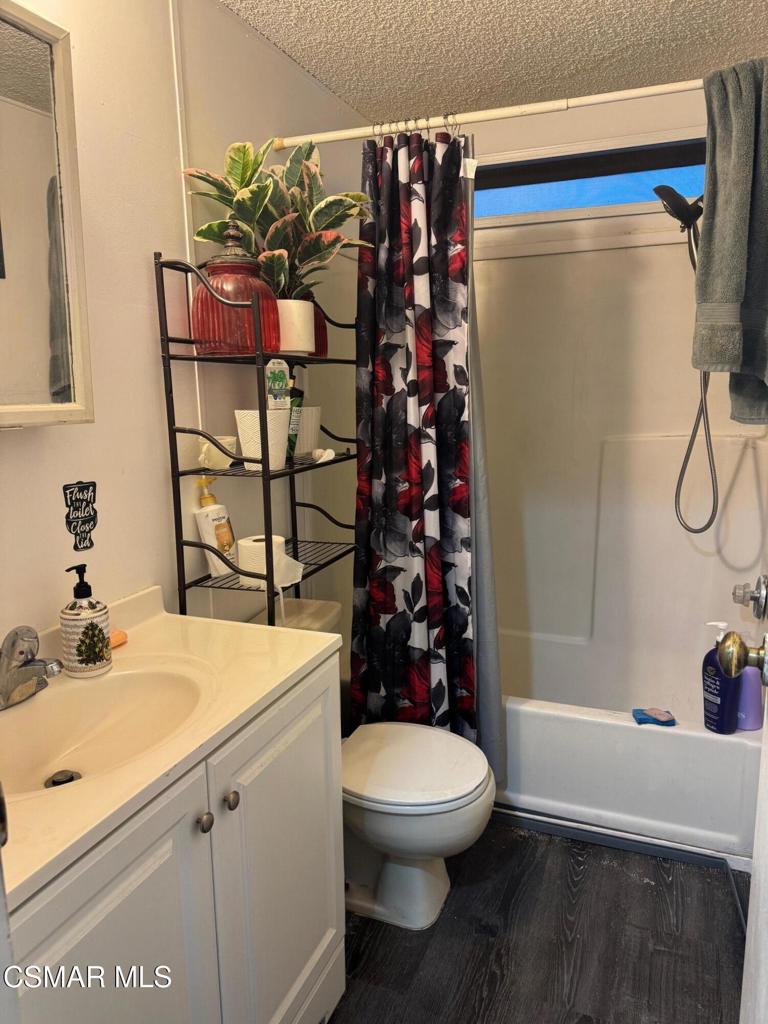 40701 Rancho Vista Boulevard, Unit 76 Palmdale, CA 93551 - Photo 15 of 31 a bathroom with a sink toilet and shower