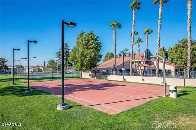 40701 Rancho Vista Boulevard, Unit 76 Palmdale, CA 93551 - Photo 30 of 31 a front view of a house with a yard