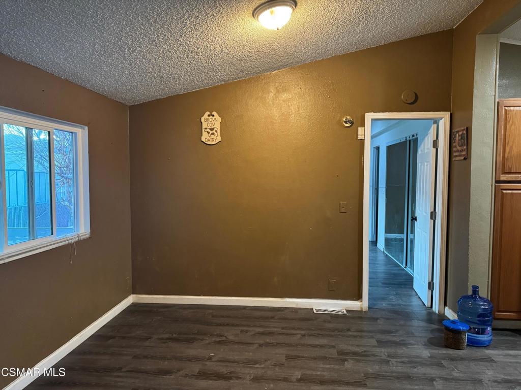 40701 Rancho Vista Boulevard, Unit 76 Palmdale, CA 93551 - Photo 8 of 31 a view of a livingroom with wooden floor