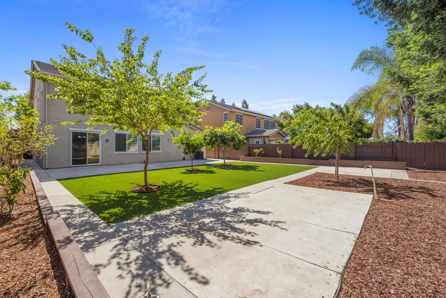 3105 Ripple Court Modesto, CA 95355 - Photo 45 of 46 a view of a backyard with a garden