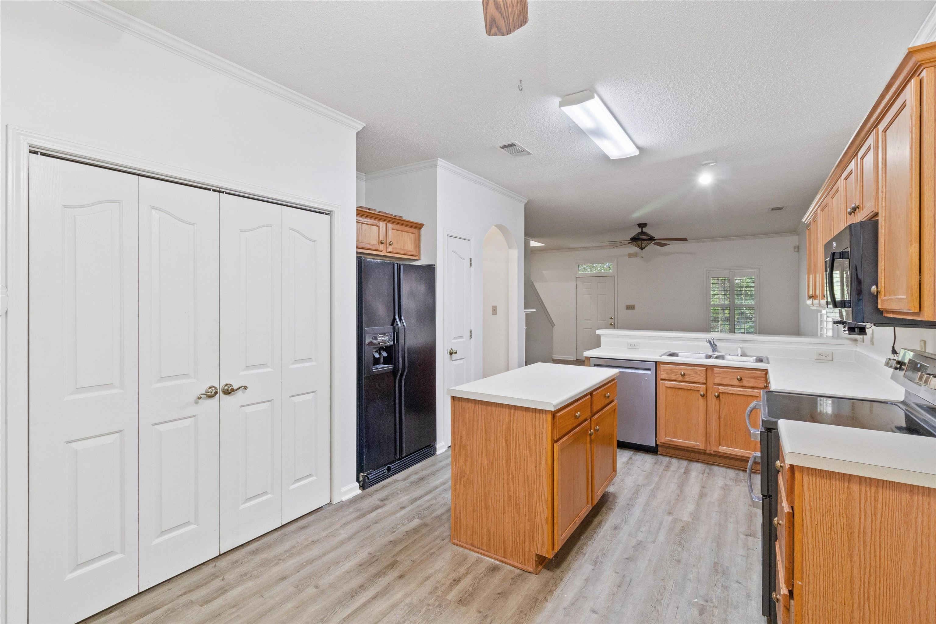 1262 South Collierville Arlington Road Collierville, TN 38017 - Photo 12 of 26 a kitchen that has a lot of cabinets a sink and wooden floor