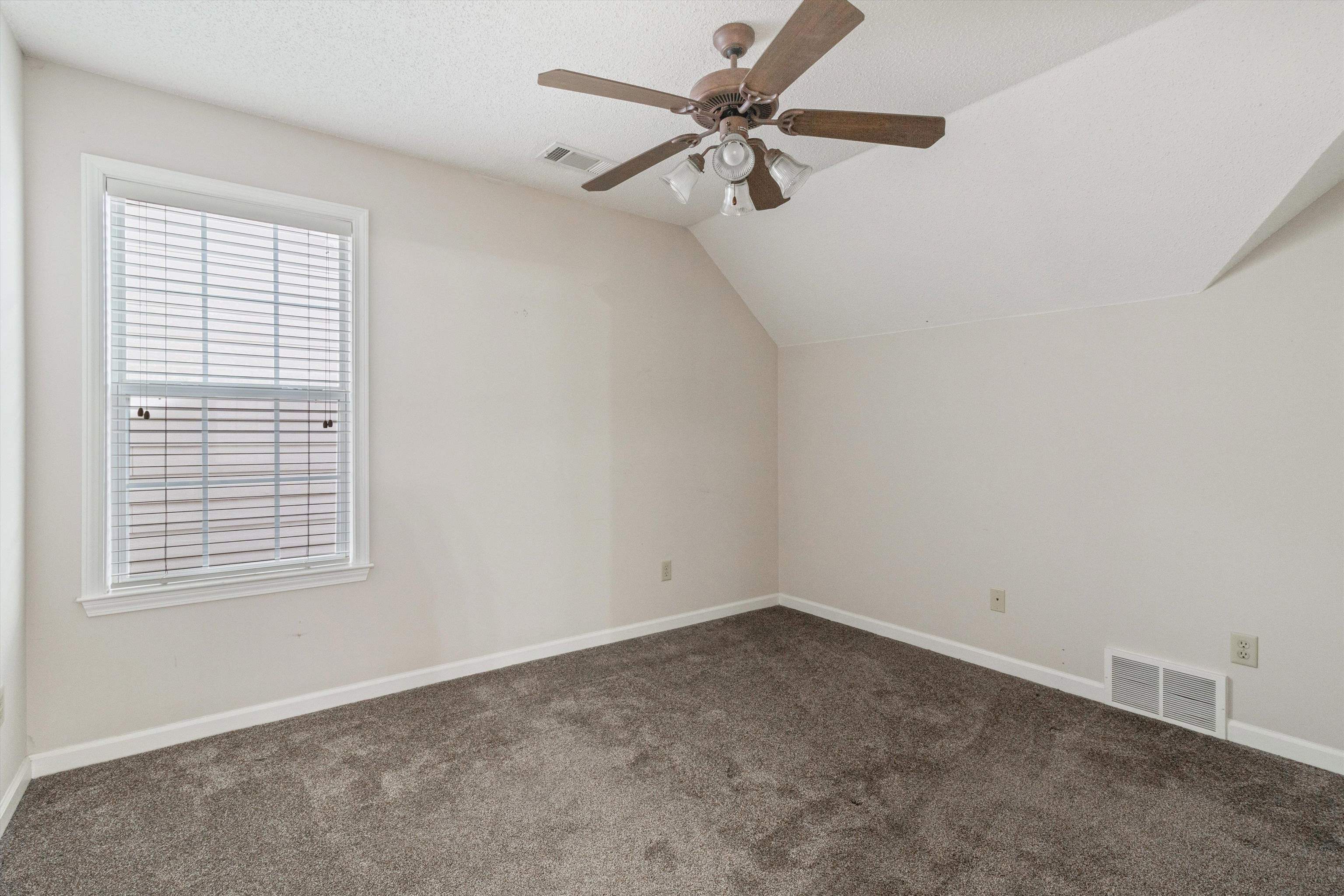 1262 South Collierville Arlington Road Collierville, TN 38017 - Photo 20 of 26 an empty room with a window and a fan