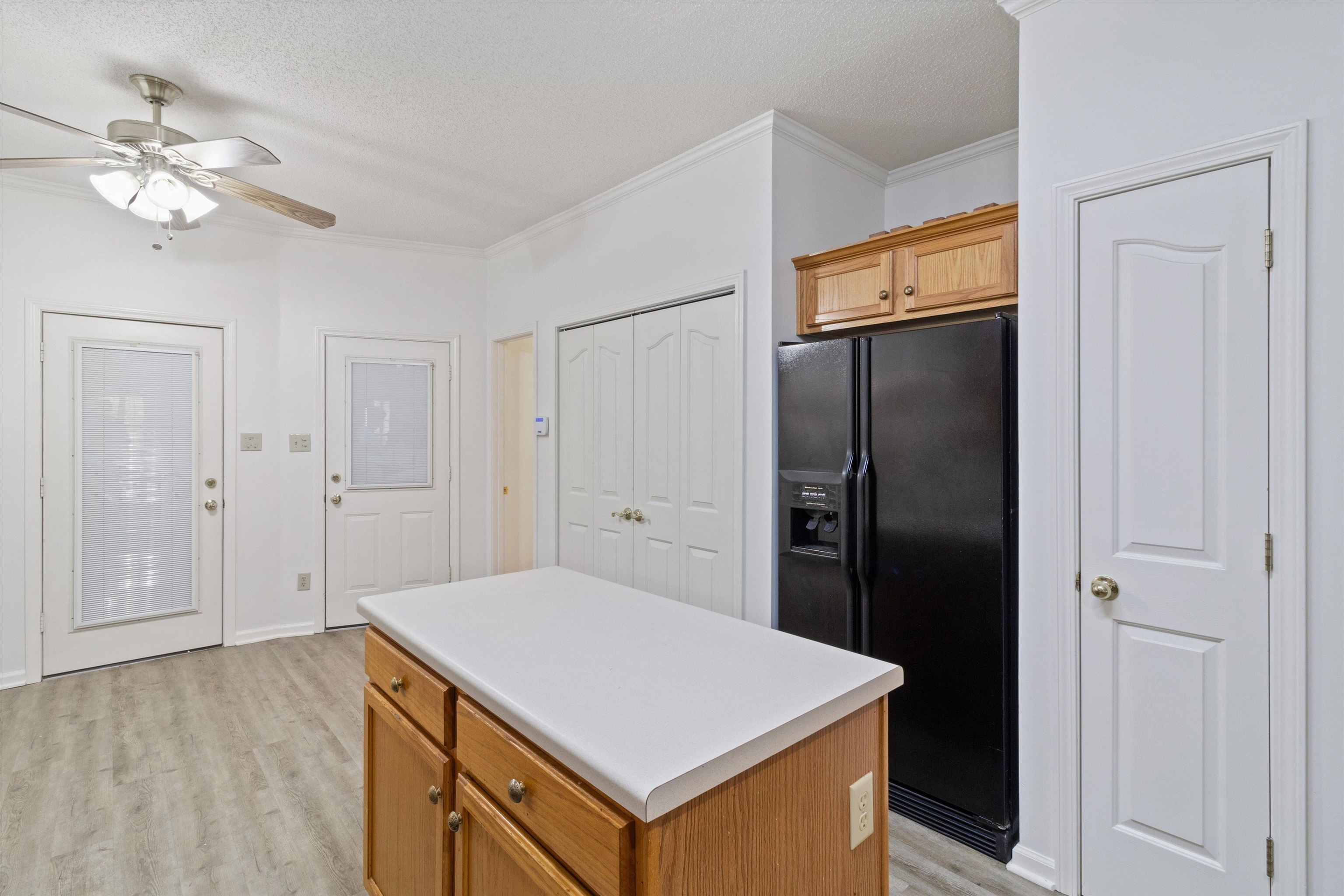 1262 South Collierville Arlington Road Collierville, TN 38017 - Photo 10 of 26 a kitchen with a refrigerator and a sink