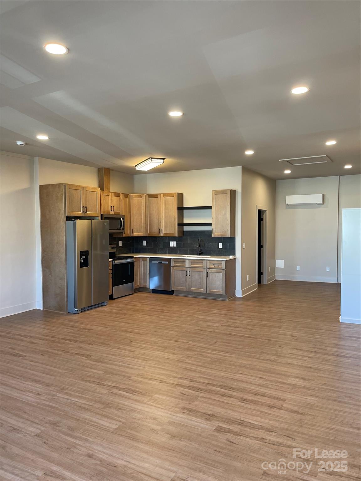 233 West Main Street, Unit A Albemarle, NC 28001 - Photo 4 of 10 a view of kitchen with refrigerator and microwave