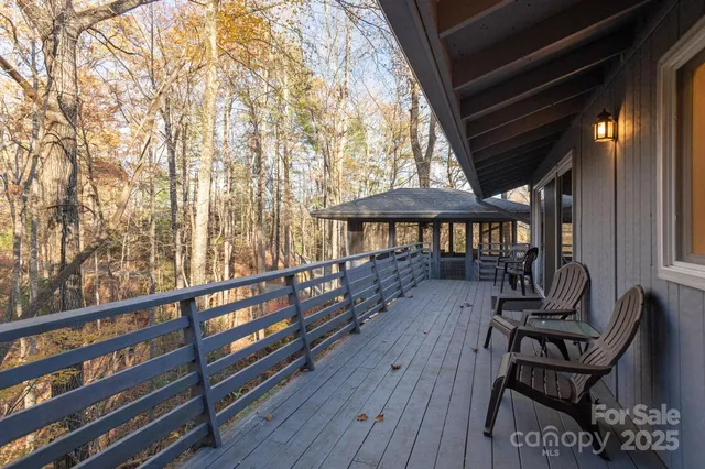 a view of a balcony with chairs