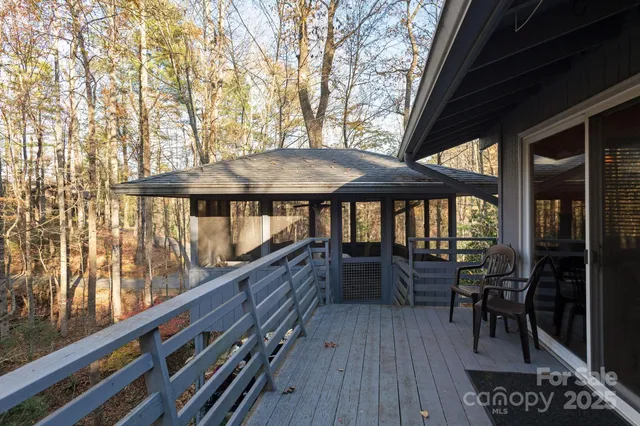 a view of a two chairs and table in the balcony