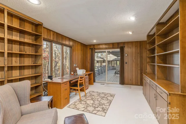 a living room with a couch and a bookshelf