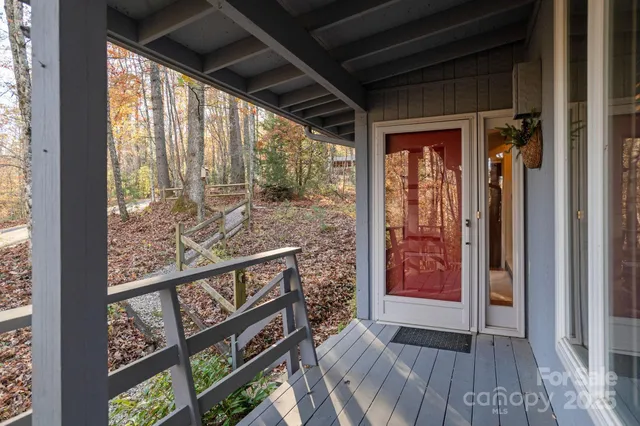 a view of a porch with wooden floor