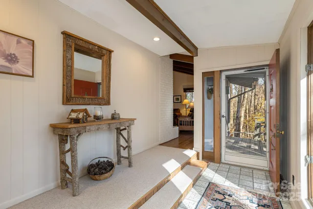 a room with a table and chairs