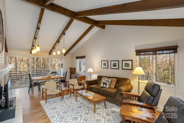 a living room with furniture and a table