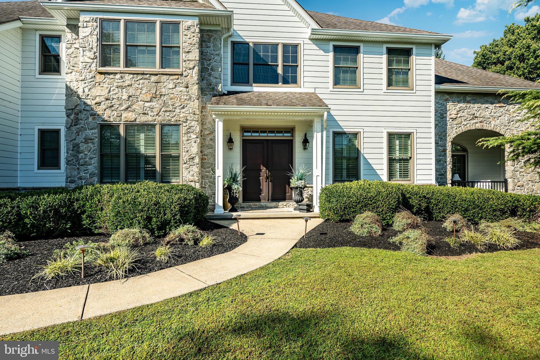 4 Amanda Lane West Chester, PA 19380 - Photo 2 of 108 a front view of a house with a yard