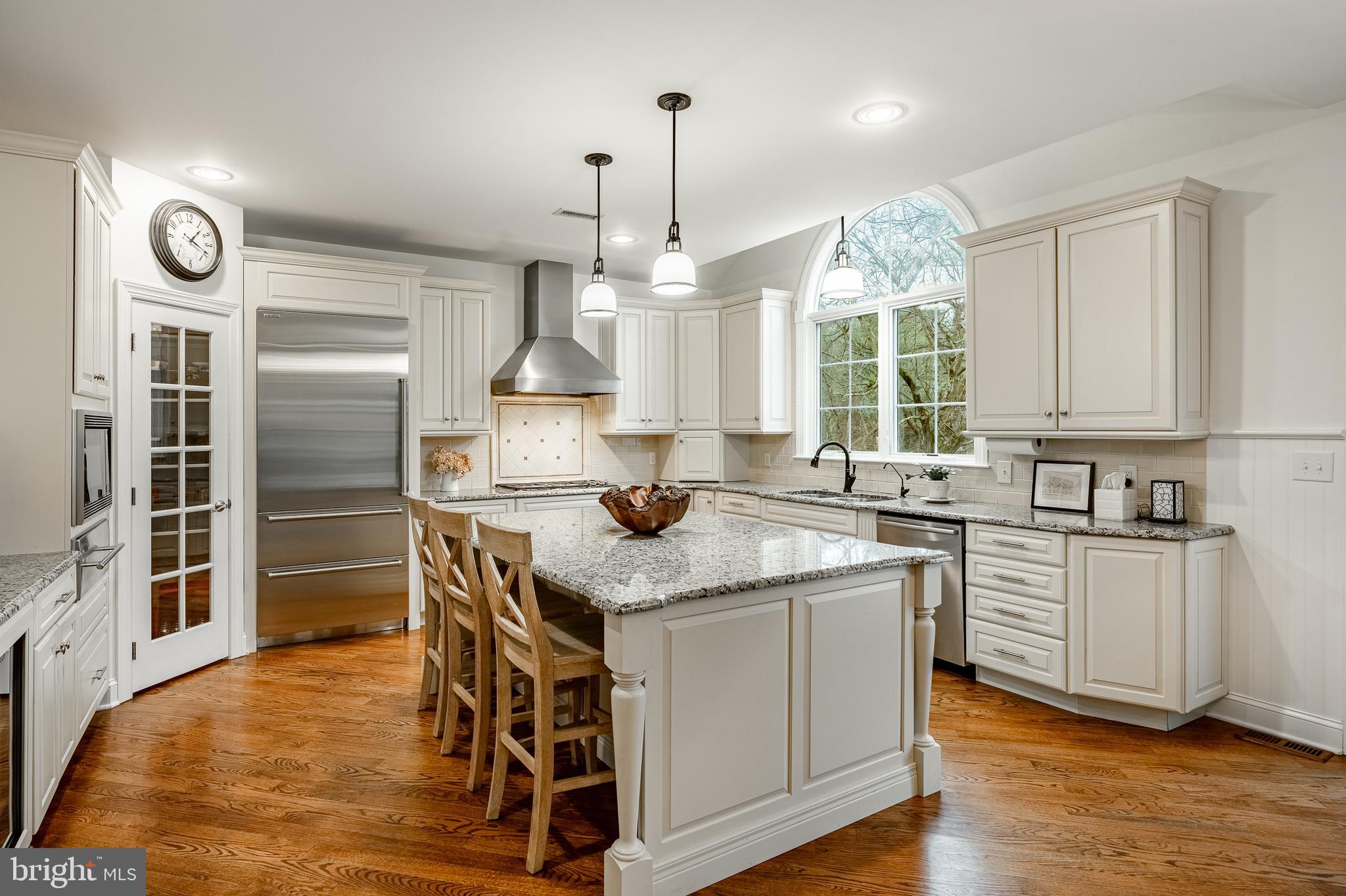 4 Amanda Lane West Chester, PA 19380 - Photo 23 of 108 a kitchen with kitchen island granite countertop a sink cabinets and wooden floor