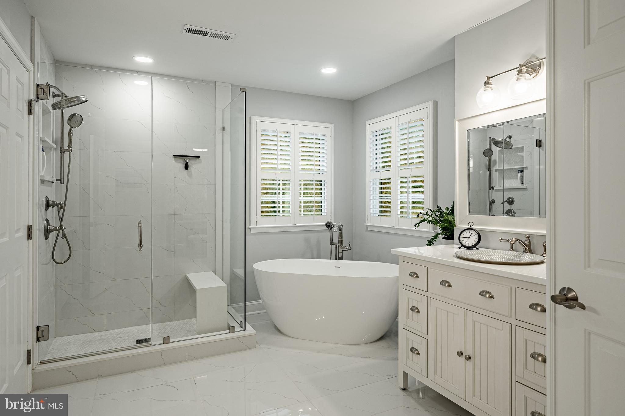 4 Amanda Lane West Chester, PA 19380 - Photo 47 of 108 a spacious bathroom with 2 sink tub shower and a mirror