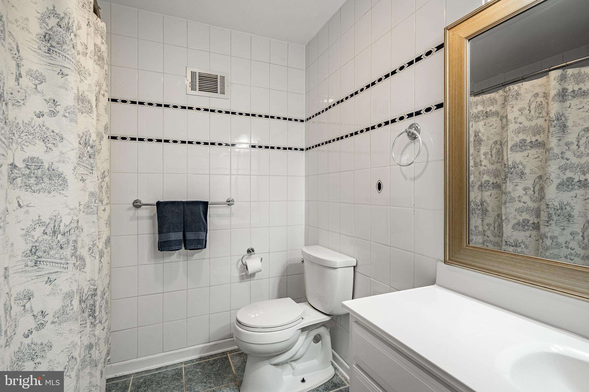 4 Amanda Lane West Chester, PA 19380 - Photo 62 of 108 a bathroom with a toilet sink and shower