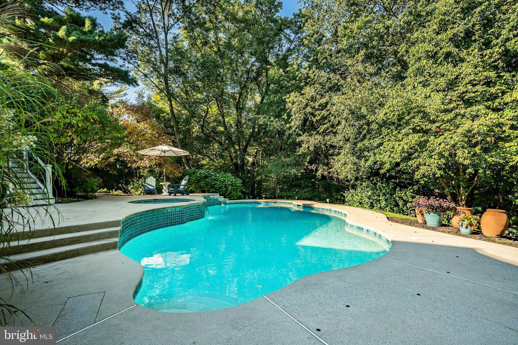 4 Amanda Lane West Chester, PA 19380 - Photo 66 of 108 a view of a swimming pool with a yard and large trees