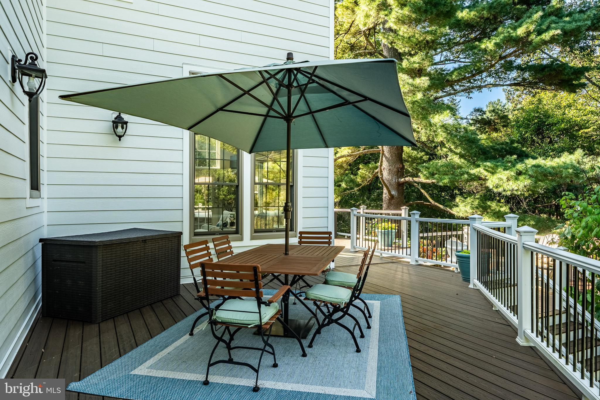 4 Amanda Lane West Chester, PA 19380 - Photo 70 of 108 a view of a roof deck with table and chairs under an umbrella