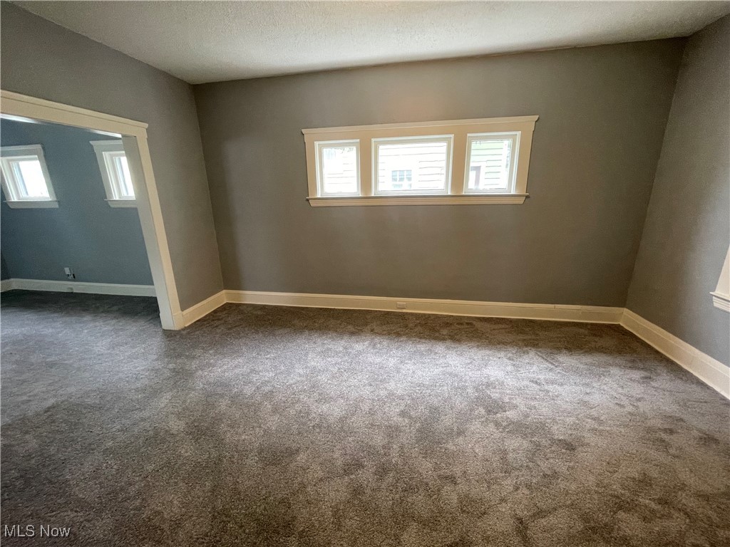 912 Yellowstone Road Cleveland Heights, OH 44121 - Photo 15 of 35 Empty room with dark carpet