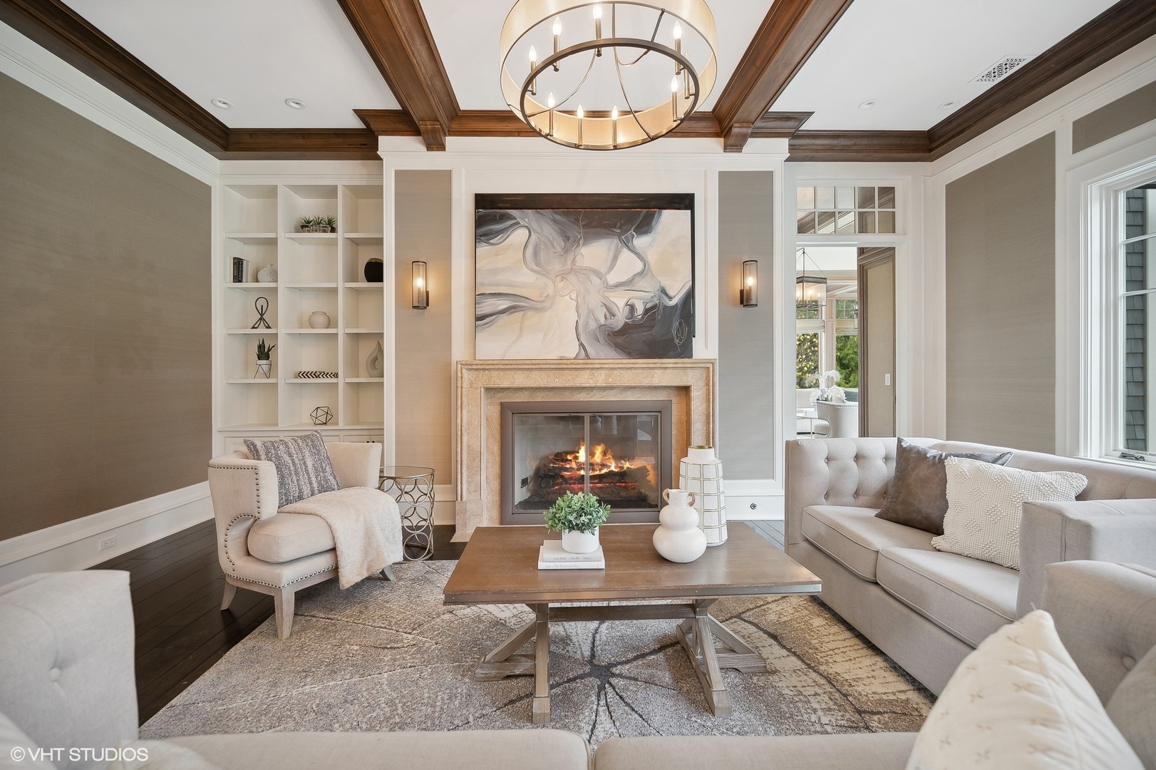 931 Sunset Road Winnetka, IL 60093 - Photo 9 of 42 a living room with furniture a fireplace and a large mirror