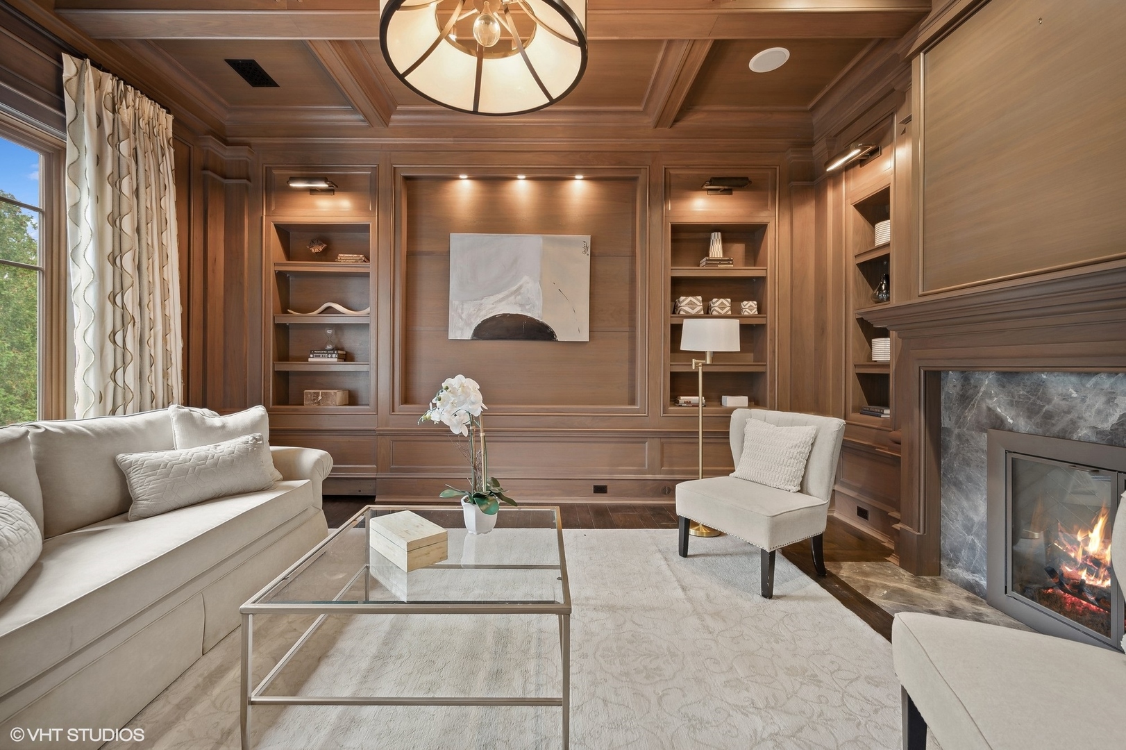 931 Sunset Road Winnetka, IL 60093 - Photo 25 of 42 a living room with furniture and a fireplace