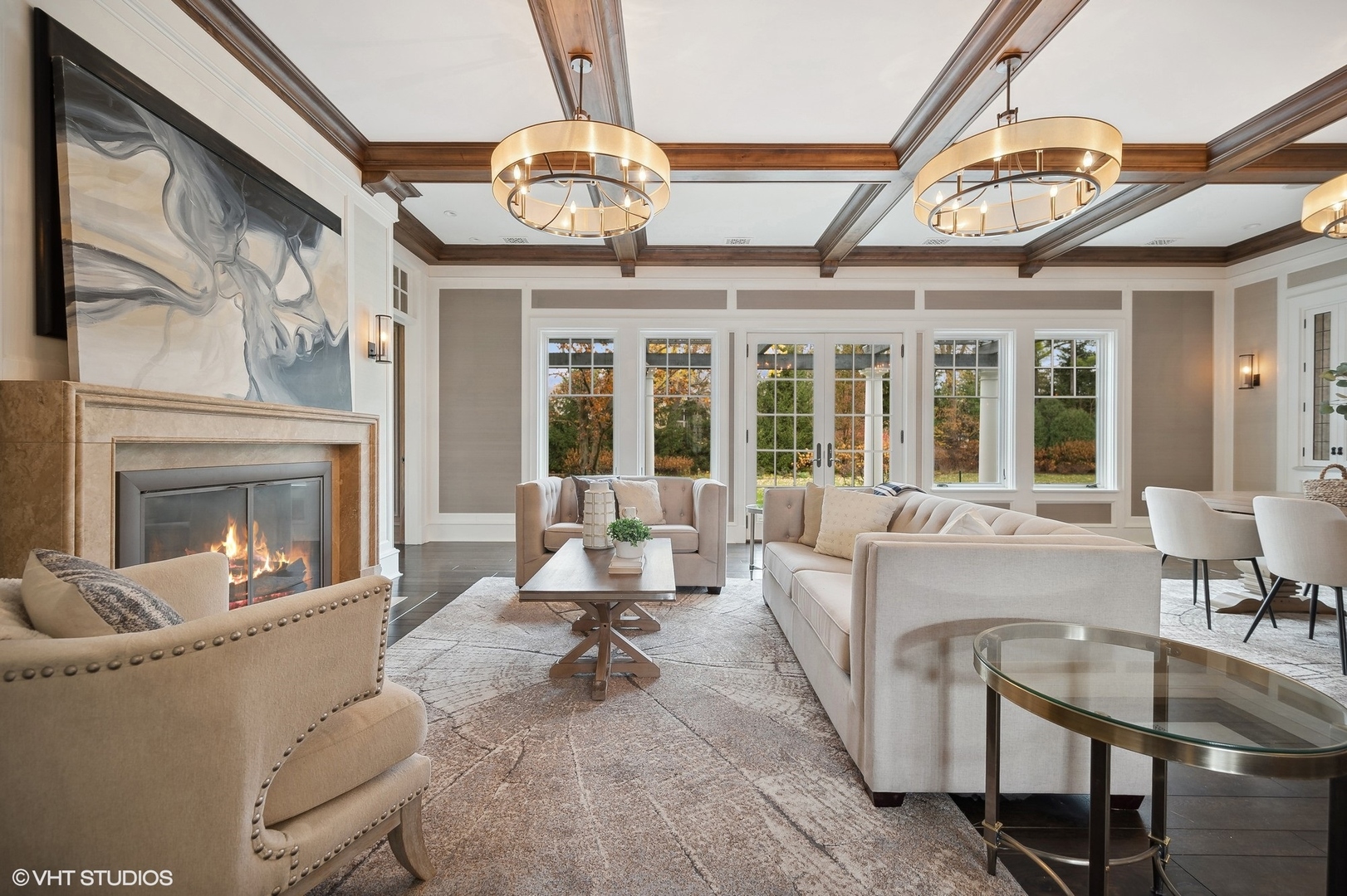 931 Sunset Road Winnetka, IL 60093 - Photo 7 of 42 a living room with furniture a fireplace and a chandelier