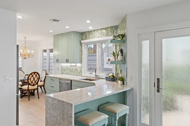 a large bathroom with a tub and sink