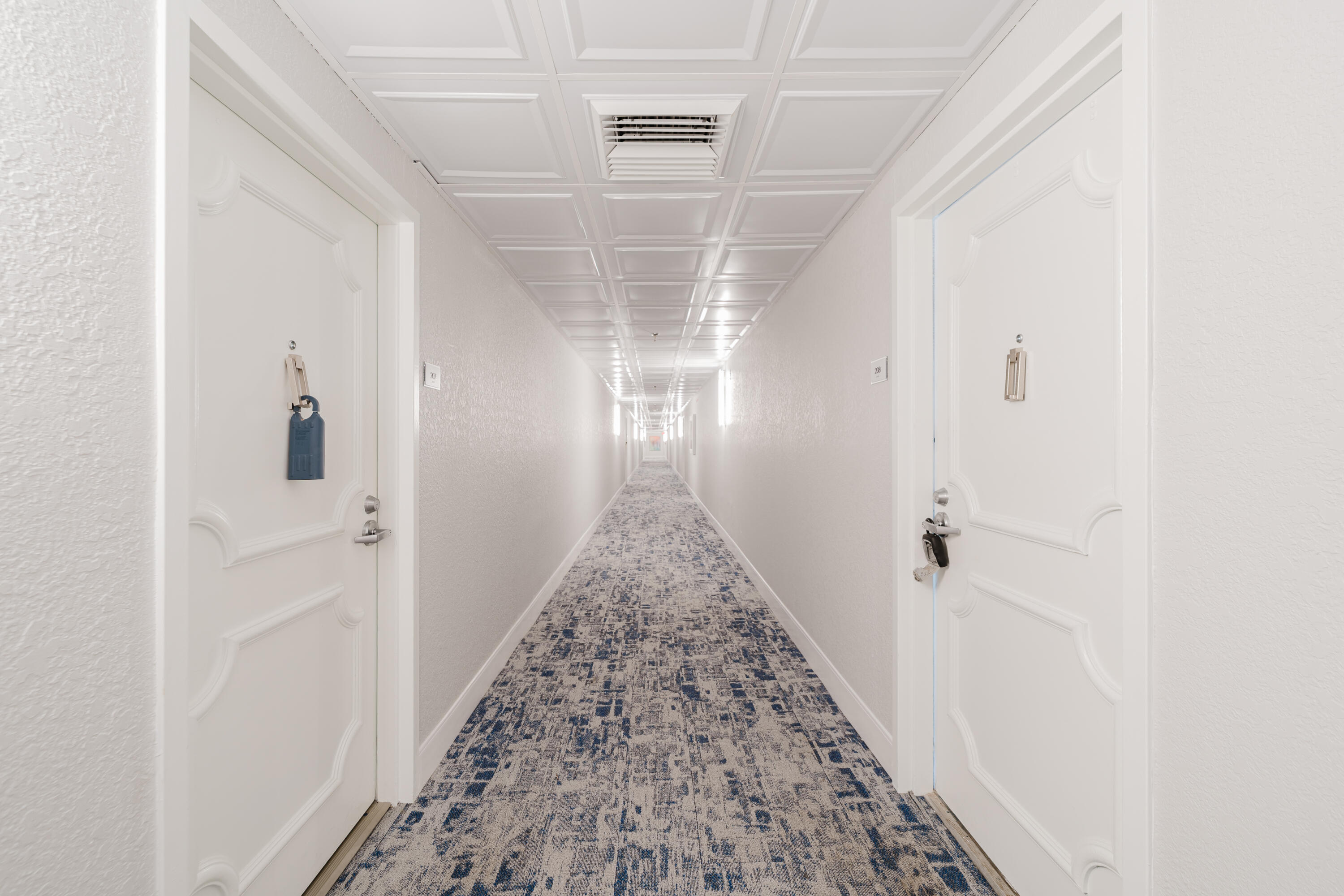 859 Jeffery Street, Unit 208 Boca Raton, FL 33487 - Photo 11 of 39 a view of a hallway view with wooden floor and staircase