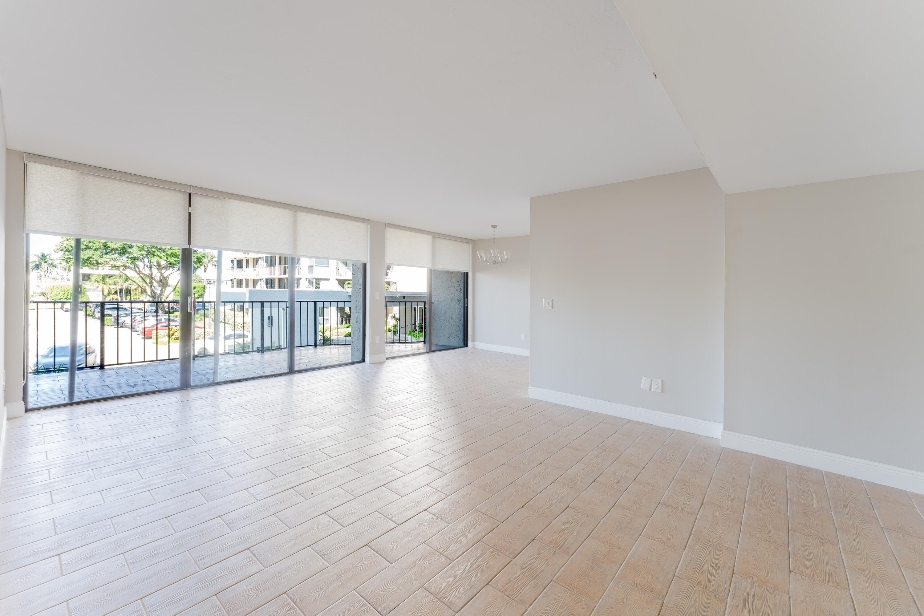 859 Jeffery Street, Unit 208 Boca Raton, FL 33487 - Photo 13 of 39 wooden floor in an empty room with a window