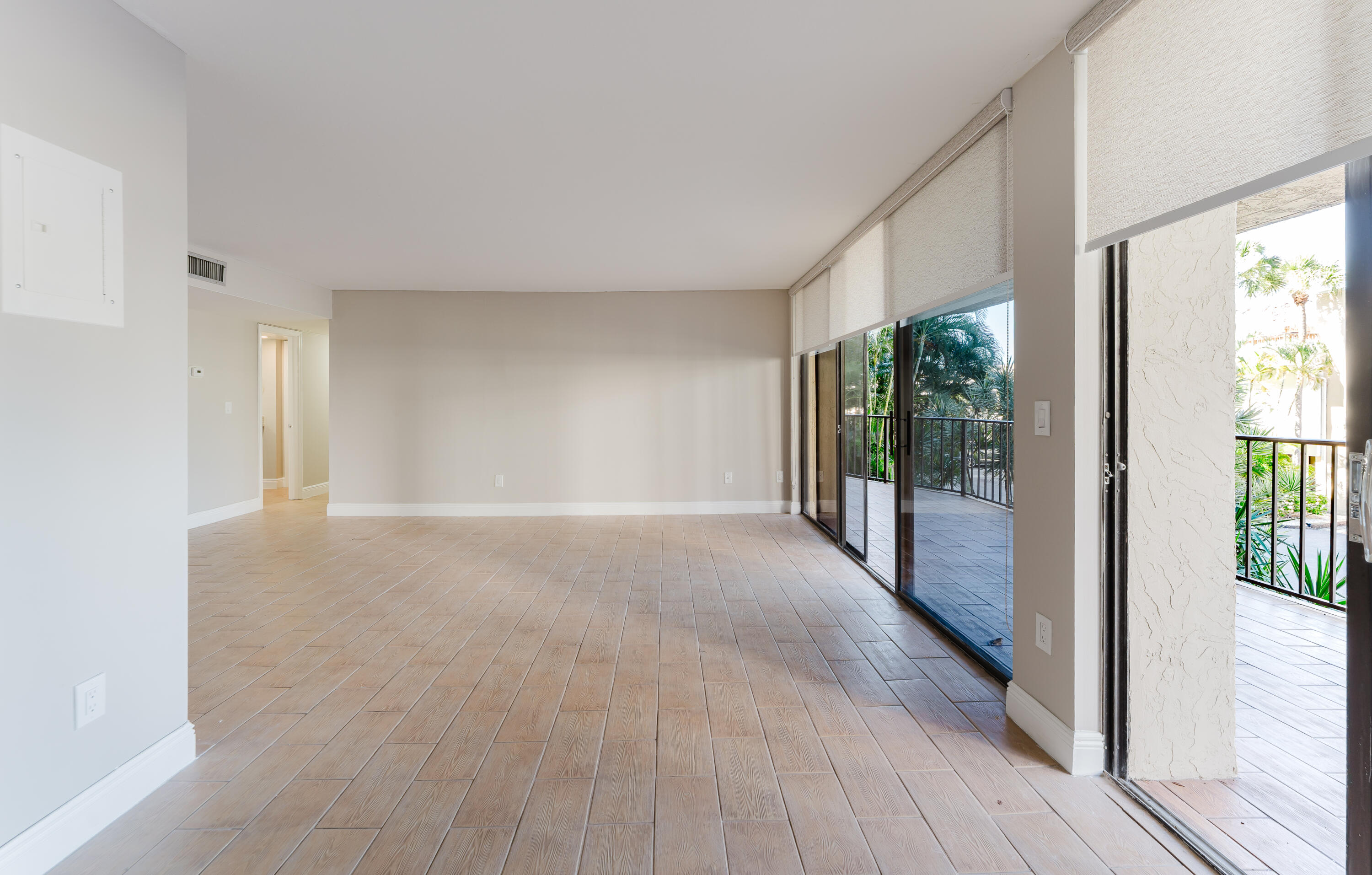 859 Jeffery Street, Unit 208 Boca Raton, FL 33487 - Photo 16 of 39 a view of a hallway with wooden floor and windows