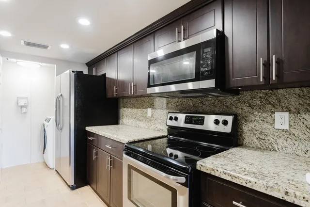 a kitchen with a stove microwave and refrigerator