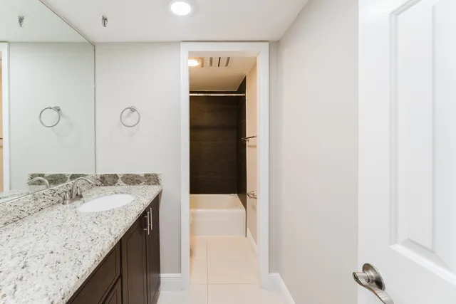 a bathroom with a bathtub and shower